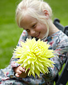 Girl holding dahlia