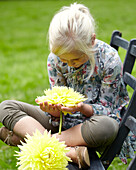 Girl holding dahlia