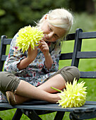 Girl holding dahlia