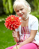 Girl holding dahlia