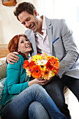 Couple holding flowers