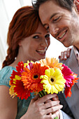 Couple holding flowers