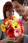 Couple holding flowers