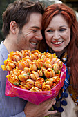 Couple holding flowers