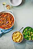 One pot beef stew with vegetable puree and broccoli and pea vegetables