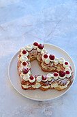 Choux pastry heart with vanilla white chocolate cream cheese and raspberry confit