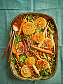 Grain salad with oranges, pistachios and fermented carrots