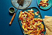 Jacket potatoes with chorizo, chilli flakes and cheese