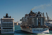 Cruise ships in port expelling smoke