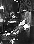 Dentist preparing to extract tooth, 1909