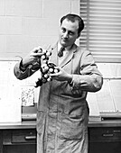Scientist with molecule model