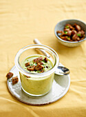 Cream of pea soup with herb croutons