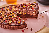 Chocolate tart with seeds and dried fruit