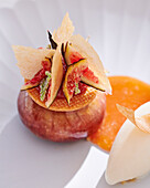 Artistic fig dessert with lemongrass sorbet