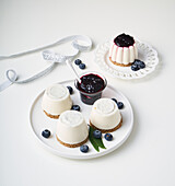 Panna cotta on brown bread with blueberry jam