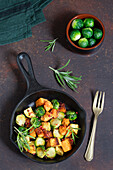 Baked potatoes with pumpkin and Brussels sprouts