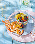 Prawn skewers and black rice salad with mango