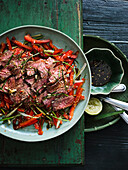 Thai-style beef salad with lime leaves and chillies