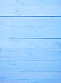 Light blue wooden background