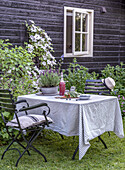 Set garden table with striped blanket and lavender