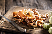 Onion skins on a chopping board