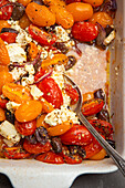 Date tomatoes with feta and black olives from the oven