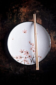 Oriental plate with chopsticks