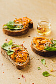 Bread with hummus, lamb's lettuce and sprouts