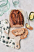 Sourdough spelt bread with poppy seeds and homemade herb butter