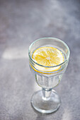 Glass with water and lemon slice