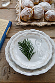 Plate with fir branch, glass bottle stopper and tray with biscuits