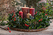 Advent wreath with red winterberry (Ilex verticillata), holly 'Blue Prince' (Ilex meserveae)