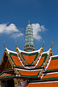 Roof detal & Phra Asada Maha Chedi by the Temple of the Emerald Buddha at the Grand Palace complex in Bangkok, Thailand.