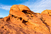 An unnamed natural arch in the eroded Aztec sandstone of Valley of Fire State Park in Nevada.