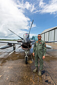 A Dominican Air Force pilot by a Super Tucano fighter aircraft at the San Isidro Air Base in the Dominican Republic.