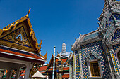 Ornately-decorated buildings by the Temple of the Emerald Buddha at the Grand Palace complex in Bangkok, Thailand.