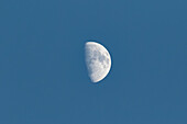 A waxing gibbous moon photographed in the daytime with a telephoto lens over New Mexico.