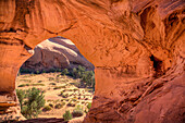 An Ancestral Puebloan ruin inside Honeymoon Arch in Mystery Valley in the Monument Valley Navajo Tribal Park in Arizona.