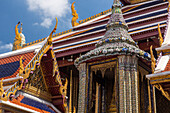 Ornately-decorated buildings around the Temple of the Emerald Buddha at the Grand Palace complex in Bangkok, Thailand.