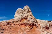 A teepee-shaped sandstone rock formation in the White Pocket Recreation Area, Vermilion Cliffs National Monument, Arizona.