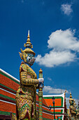 A yaksha guardian statue at the Temple of the Emerald Buddha complex in the Grand Palace grounds in Bangkok, Thailand. A yaksha or yak is a giant guardian spirit in Thai lore.