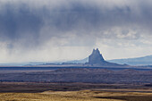 Shiprock is a volcanic basalt monolith on the Navajo Reservation near the town of Shiprock, New Mexico. Virga is the name for these streaks of rain that evaporate before reaching the desert floor.
