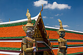 Yaksha guardian statues at the Temple of the Emerald Buddha complex in the Grand Palace grounds in Bangkok, Thailand. A yaksha or yak is a giant guardian spirit in Thai lore. Maiyarab is at left, Wirunchambang is at right.