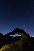 Stars over Mobius Arch in the Alabama Hills near Lone Pine, California, with the silhouette of Mt. Whitney under the arch.