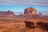 View of Monument Valley from John Ford Point in the Monument Valley Navajo Tribal Park in Arizona. L-R: Sentinal Mesa with the West Mitten in front, Big Indian Chief, Merrick Butte, the Castle, and the Stagecoach. John Ford Point is in the foreground.