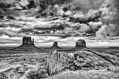 Stormy skies over the Mittens and Merrick Butte in the Monument Valley Navajo Tribal Park in Arizona.