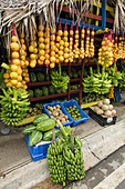 Colorful roadside fruit stand with a variety of tropical fruits on the outskirts of Navarrete, Dominican Republic.
