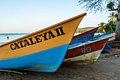 Fishing boats on the beach at Bahia de Las Galeras on the Samana Peninsula, Dominican Republic.