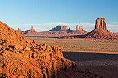 North Window view of the Utah monuments in the Monument Valley Navajo Tribal Park in Arizona. L-R: Elephant Butte (foreground), Setting Hen, Big Indian Chief, Brigham's Tomb, King on the Throne, Castle Butte, Bear and Rabbit, Stagecoach, East Mitten Butte.