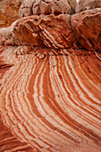 Eroded Navajo sandstone formations in the White Pocket Recreation Area, Vermilion Cliffs National Monument, Arizona. Small laterally displaced faults are evident in the stripes.